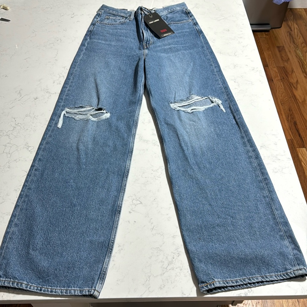 Levi’s high loose super high rise. Loose through. wide, straight leg